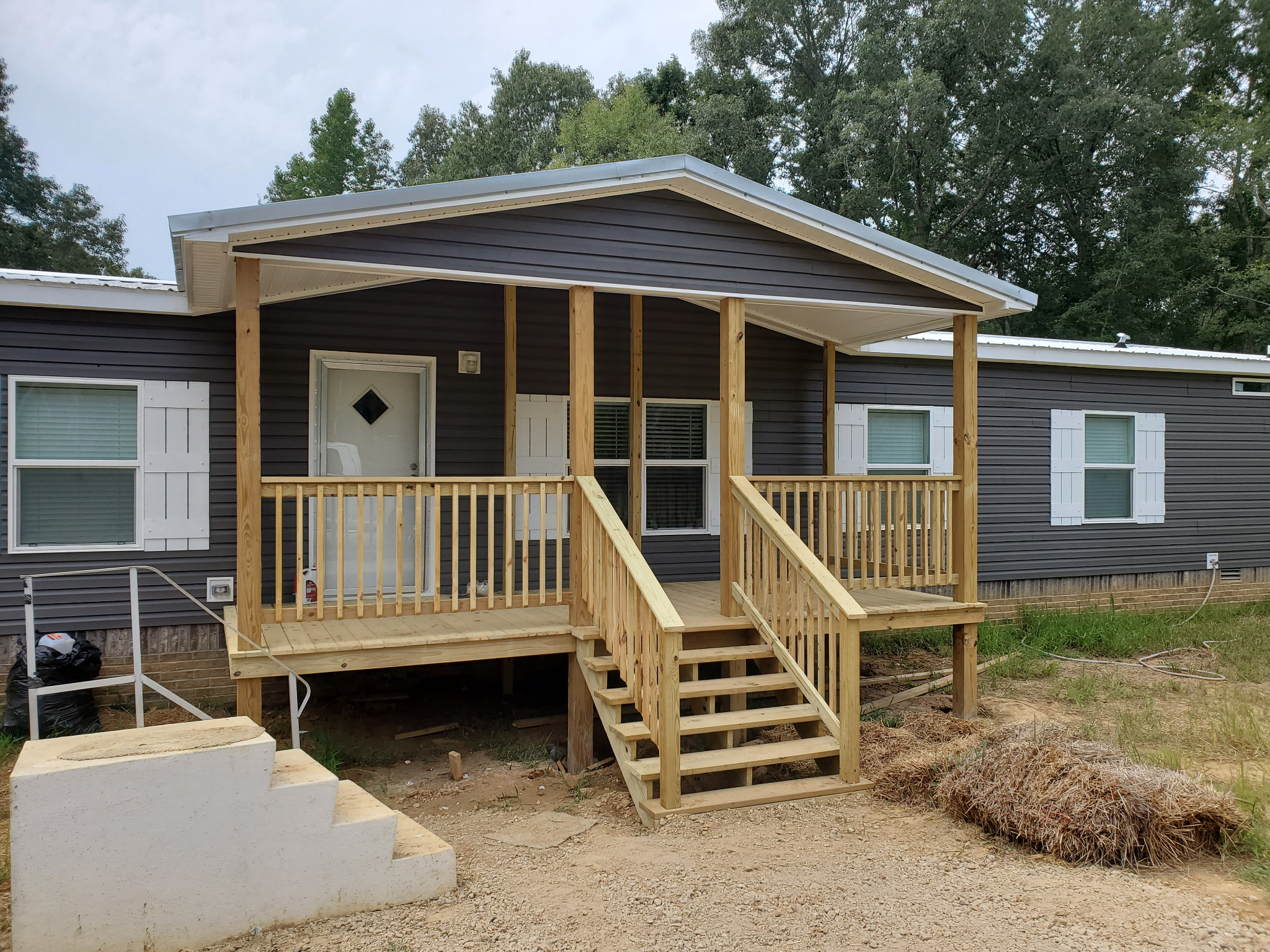 Completed covered outdoor living project by West TN Renovations